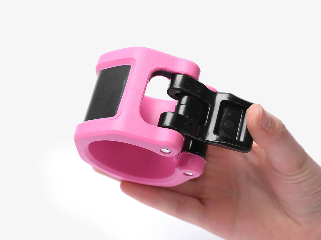 Hand Holding Pink Barbell Collar Showing Quick Release Lever