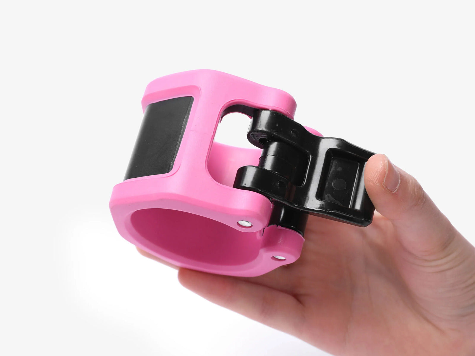 Hand Holding Pink Barbell Collar Showing Quick Release Lever