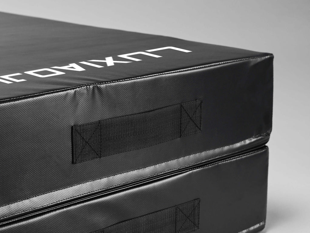 Side profile of the LUXIAOJUN shock absorption pad featuring a reinforced handle and durable exterior