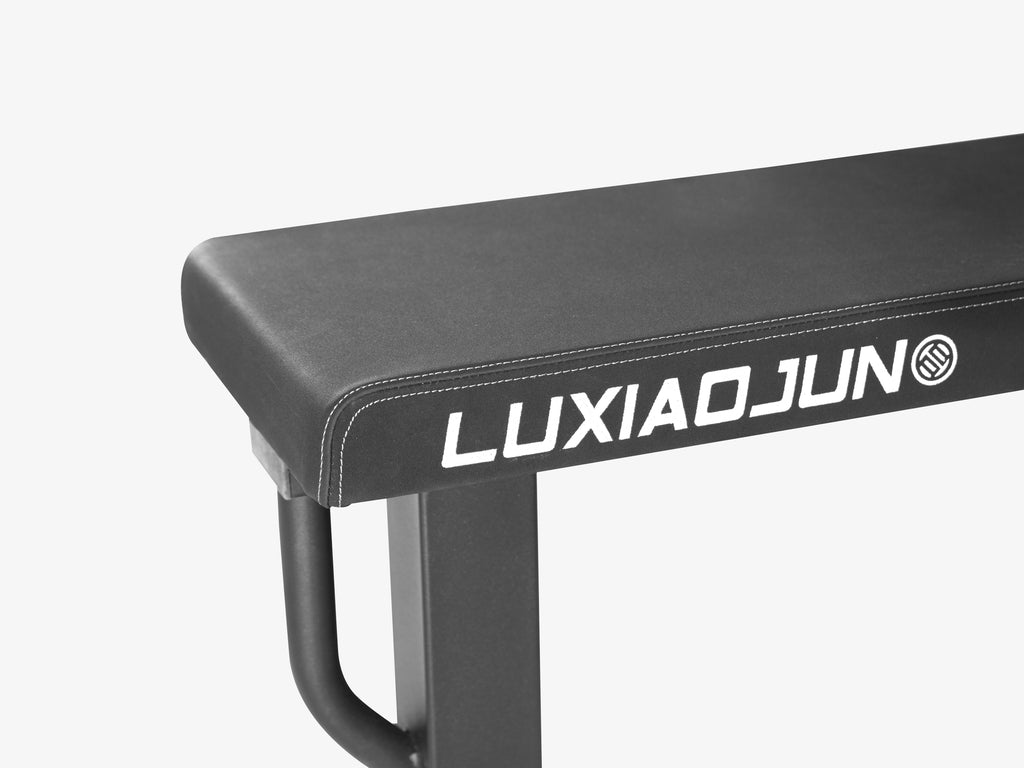 Close-up of bench pad corner with LUXIAOJUN logo on Competition Power Rack