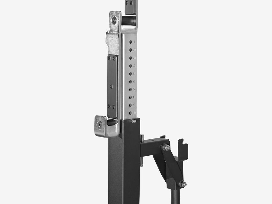 Close-up of the numbered height markings on a LUXIAOJUN Competition Power Rack upright, with the J-hook and its lever below