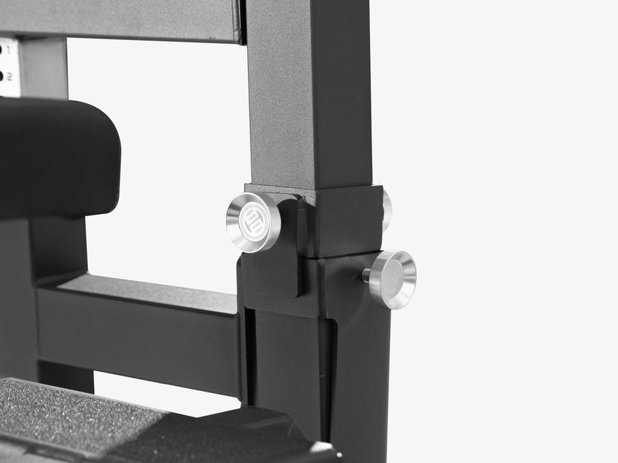 Close-up of the silver locking knobs where the bench frame meets the LUXIAOJUN Competition Power Rack