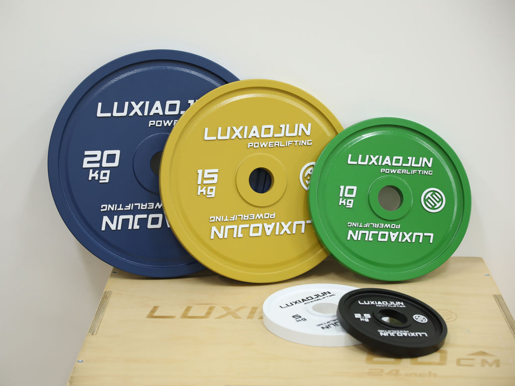 LUXIAOJUN Powerlifting Competition Plates set in assorted colors and weights on a platform box